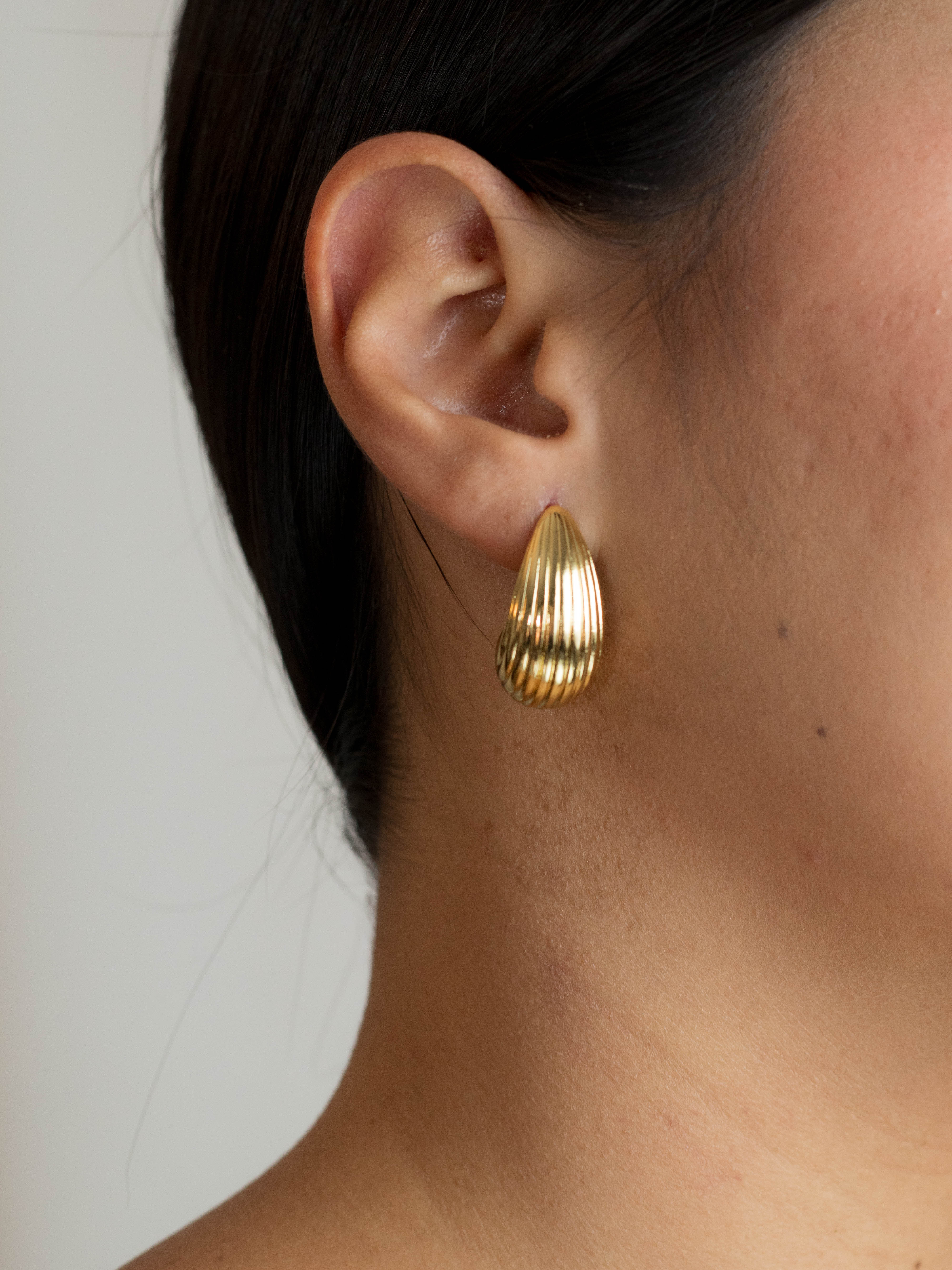 Aretes media candonga